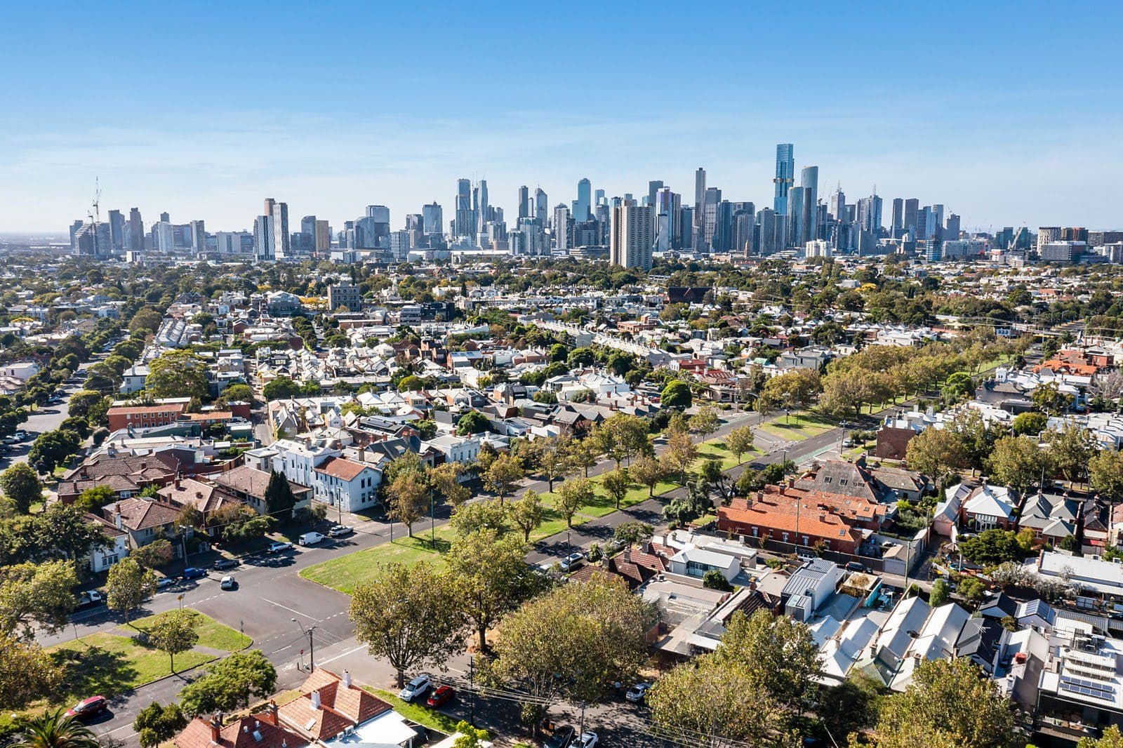 Aerial view of Melbourne suburbs with the city skyline in the distance